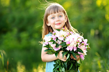 portrait of little girl outdoors in summer