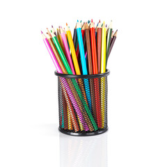 Fototapeta premium Colorful pencils in a black basket over a white background