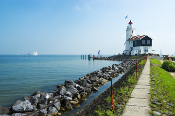 Fototapeta na wymiar The road to lighthouse, Marken, the Netherlands