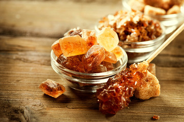Sugar. Brown Sugar on a Wooden Background