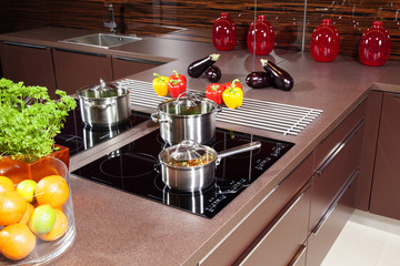 Modern kitchen  with glass induction hob.