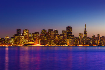 Fototapeta na wymiar San Francisco sunset skyline California bay water reflection