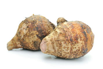 taro roots on white background