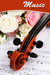Naklejka premium Classical violin with flowers on notes