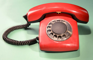 Red retro telephone,on color background
