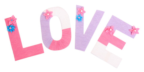 Word Love created with brightly colored knitting yard isolated