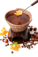 Chocolate fondue with fruits, isolated on white