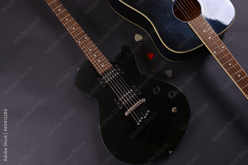 Wall mural electric and acoustic guitars on dark background