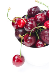 bowl of fresh cherries on a white background, selective focus