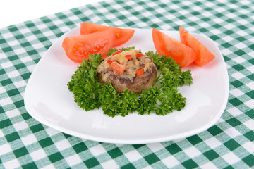 Stuffed mushrooms on plate on table close-up