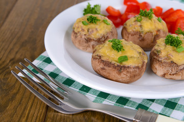 Stuffed mushrooms on plate on table close-up