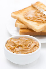 bowl of peanut butter and crispy toast