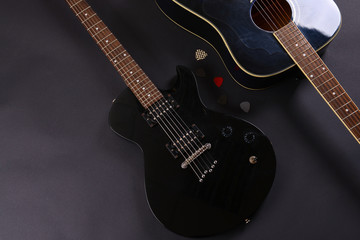 Fototapeta na wymiar Electric and acoustic guitars on dark background
