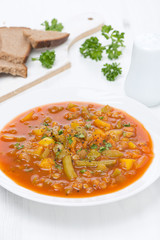 tomato soup with green lentils and vegetables, vertical
