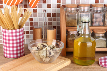 Cooking food in kitchen on table on mosaic tiles background