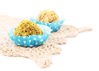 Chocolate candies with chopped nuts, isolated on white