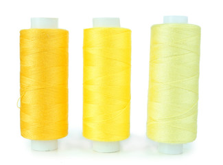 Colored spools of threads isolated on white