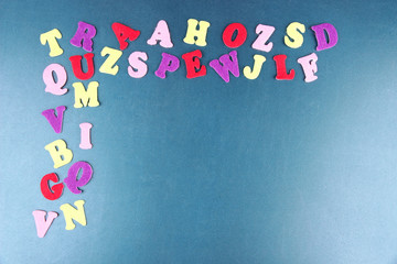 English alphabet on school desk background