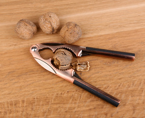 Nutcracker and walnuts  on wooden background