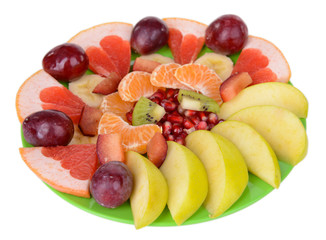 Sweet fresh fruits on plate isolated on white