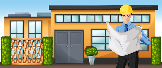 An engineer in front of a building