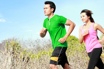 young couple running together