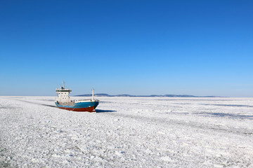 Ship in winter sea © monkylabz