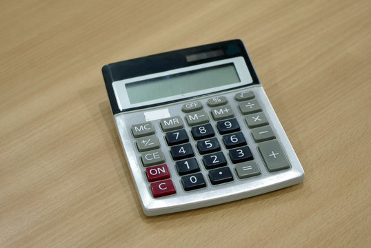 calculator on wood table