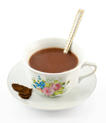 Сup with spoon and saucer with heart of coffee