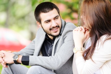 Fototapeta premium Lovely couple enjoying fall in love at park