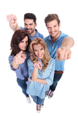 wide angle picture of  people pointing fingers