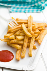french fries with ketchup on paper plate