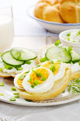 Fresh canapes with egg, cottage cheese, cucumber and herbs