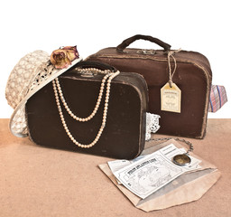 Male and female old travel suitcases