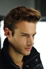 Naklejka premium Young man studio shoot posing closeup