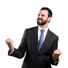 Young business man winner over white background