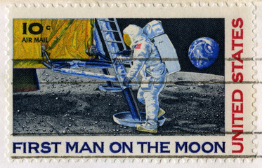 Naklejka premium US Stamp Celebrating the First Man on the Moon