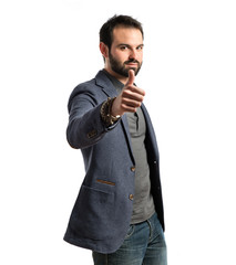 businessman making an OK gesture over isolated white background