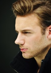 Naklejka premium Young man studio shoot posing closeup