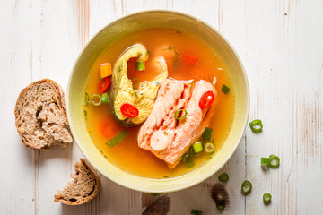 Salmon soup served with bread