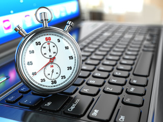 Stopwatch on laptop keyboard.