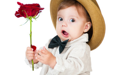 Emotional pretty baby gentleman with a rose in his hand.