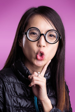 Woman with funny face over purple background