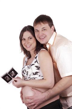 Expectant parents with baby picture