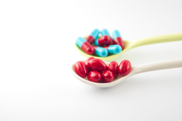 Spoon with tablet and capsule