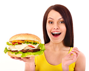 Woman holding hamburger.