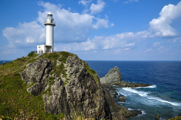 Fototapeta na wymiar Lighthouse at cliffs