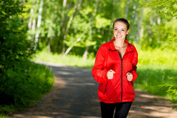 healthy young female athlete running