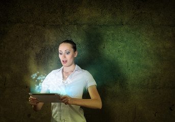 young attractive woman holding a tablet