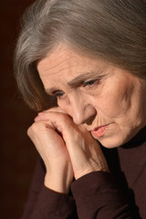 Sad elderly woman